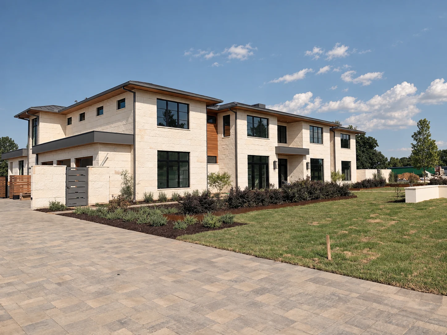 Bright modern home exterior with large black-framed windows